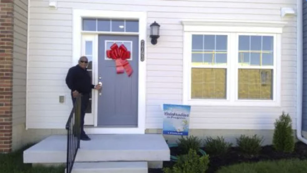 picture of Keith H. in front of a house